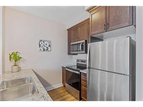 705-16 Concord Place, Grimsby, ON - Indoor Photo Showing Kitchen With Double Sink