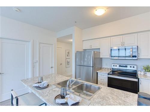 519-16 Concord Place, Grimsby, ON - Indoor Photo Showing Kitchen With Double Sink