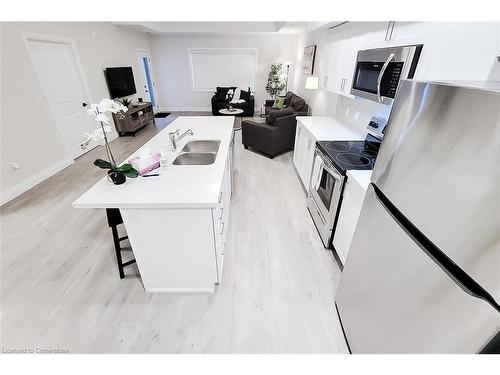 308-4514 Ontario Street, Beamsville, ON - Indoor Photo Showing Kitchen With Double Sink