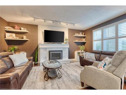 65 Derek Drive, Hamilton, ON - Indoor Photo Showing Living Room With Fireplace