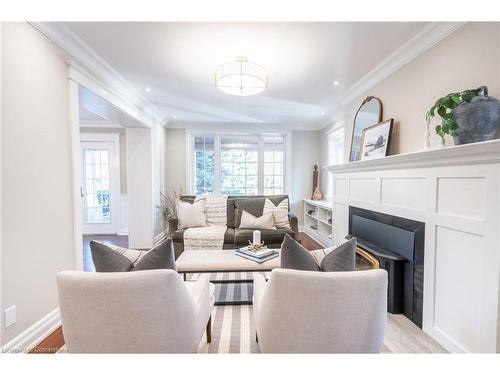 1016 North Shore Boulevard E, Burlington, ON - Indoor Photo Showing Living Room With Fireplace