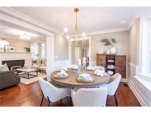 1016 North Shore Boulevard E, Burlington, ON - Indoor Photo Showing Dining Room With Fireplace