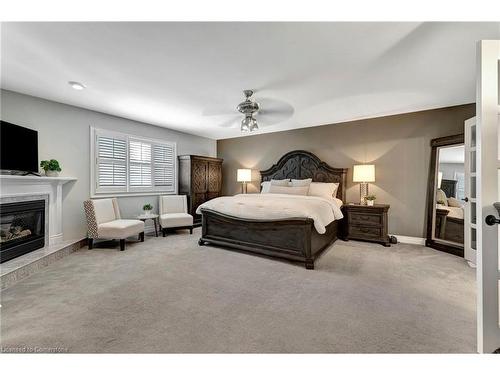 636 Greenravine Drive, Ancaster, ON - Indoor Photo Showing Bedroom With Fireplace