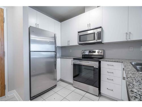 411-383 Main Street E, Milton, ON - Indoor Photo Showing Kitchen With Stainless Steel Kitchen