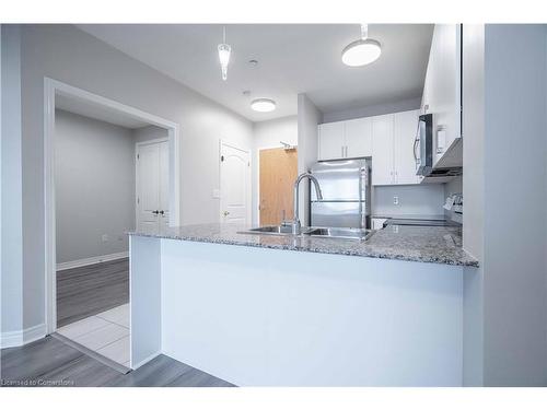 411-383 Main Street E, Milton, ON - Indoor Photo Showing Kitchen With Double Sink