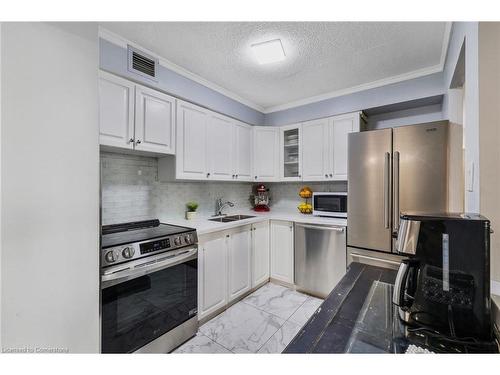 1107-975 Warwick Court, Burlington, ON - Indoor Photo Showing Kitchen With Double Sink