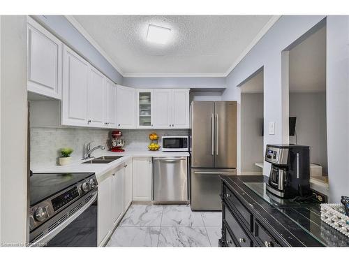 1107-975 Warwick Court, Burlington, ON - Indoor Photo Showing Kitchen With Double Sink