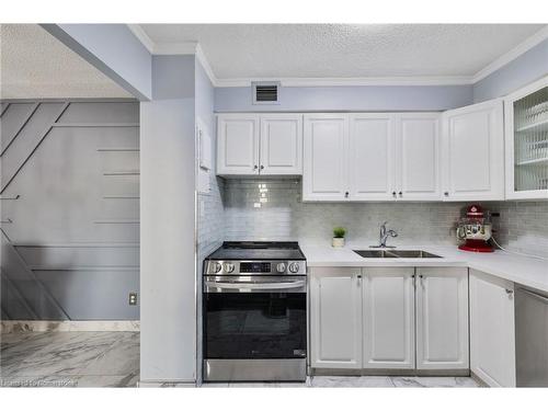 1107-975 Warwick Court, Burlington, ON - Indoor Photo Showing Kitchen With Double Sink