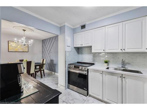 1107-975 Warwick Court, Burlington, ON - Indoor Photo Showing Kitchen With Double Sink