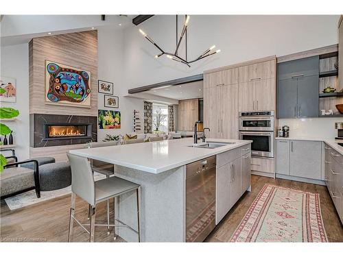 21-4360 Millcroft Park Drive, Burlington, ON - Indoor Photo Showing Kitchen With Fireplace