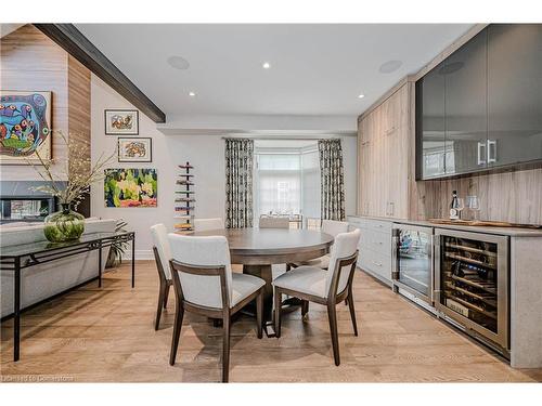 21-4360 Millcroft Park Drive, Burlington, ON - Indoor Photo Showing Dining Room With Fireplace