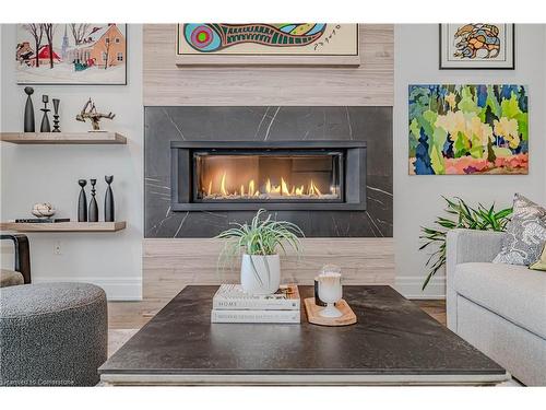 21-4360 Millcroft Park Drive, Burlington, ON - Indoor Photo Showing Living Room With Fireplace