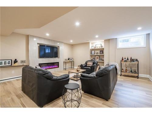 8881 Joseph Court, Niagara Falls, ON - Indoor Photo Showing Basement With Fireplace