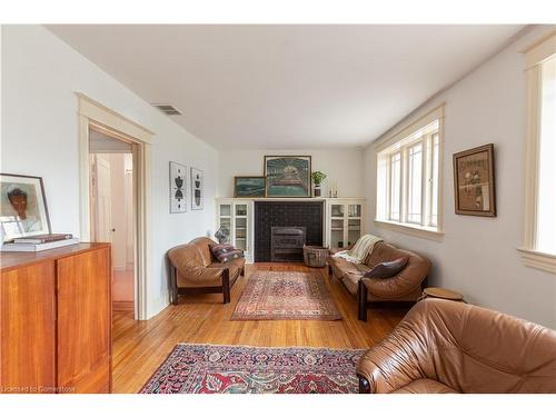 31 St Clair Avenue, Hamilton, ON - Indoor Photo Showing Living Room With Fireplace