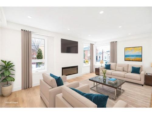 Main-34 Crooks Street, Hamilton, ON - Indoor Photo Showing Living Room With Fireplace