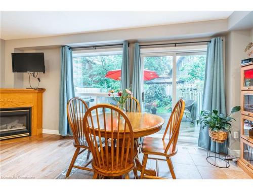 31-10 Cadham Boulevard, Hamilton, ON - Indoor Photo Showing Dining Room With Fireplace