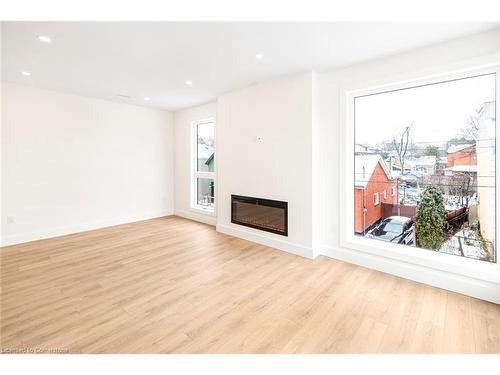 2Nd Floor-34 Crooks Street, Hamilton, ON - Indoor Photo Showing Living Room With Fireplace