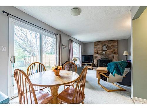 463 Knightsbridge Crescent, Ancaster, ON - Indoor Photo Showing Dining Room With Fireplace