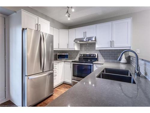 310-1431 Walker'S Line, Burlington, ON - Indoor Photo Showing Kitchen With Double Sink With Upgraded Kitchen