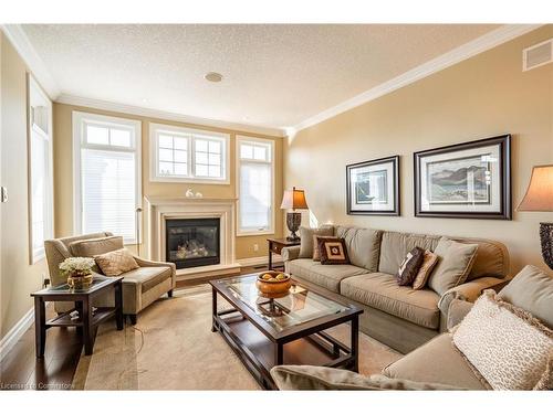 24-875 University Avenue E, Waterloo, ON - Indoor Photo Showing Living Room With Fireplace