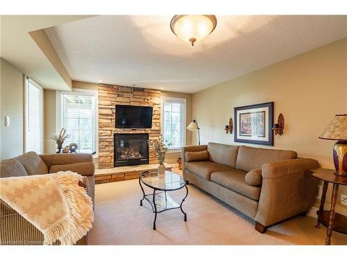 24-875 University Avenue E, Waterloo, ON - Indoor Photo Showing Living Room With Fireplace