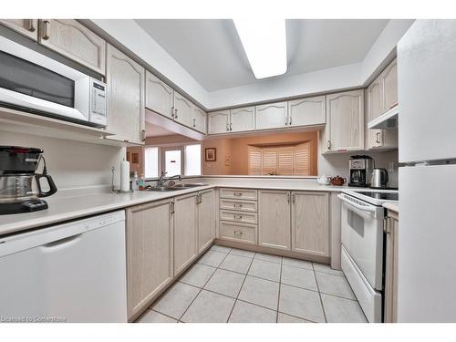 B406-216 Plains Road W, Burlington, ON - Indoor Photo Showing Kitchen With Double Sink