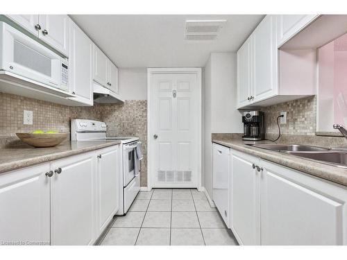 B406-216 Plains Road W, Burlington, ON - Indoor Photo Showing Kitchen With Double Sink