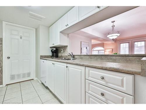 B406-216 Plains Road W, Burlington, ON - Indoor Photo Showing Kitchen With Double Sink