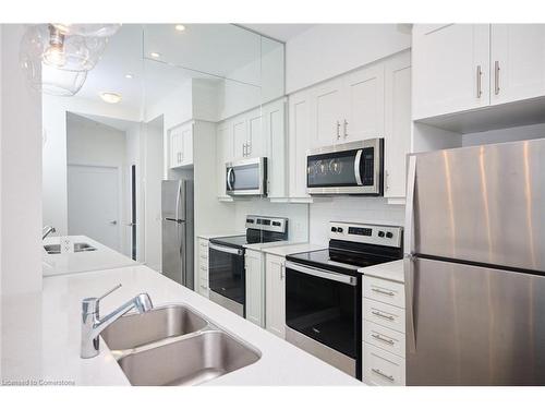 1007-16 Concord Place, Grimsby, ON - Indoor Photo Showing Kitchen With Double Sink