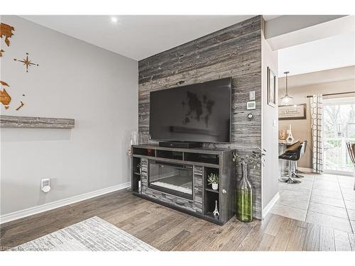 4-2220 Queensway Drive, Burlington, ON - Indoor Photo Showing Living Room With Fireplace