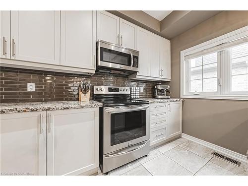 4-2220 Queensway Drive, Burlington, ON - Indoor Photo Showing Kitchen With Upgraded Kitchen