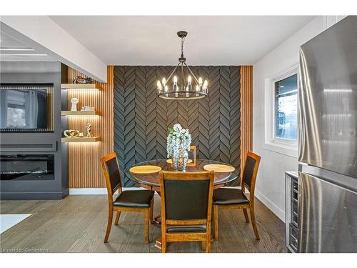 15 Andres Street, Virgil, ON - Indoor Photo Showing Dining Room With Fireplace