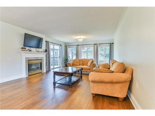 214 Silverbirch Boulevard, Mount Hope, ON - Indoor Photo Showing Living Room With Fireplace