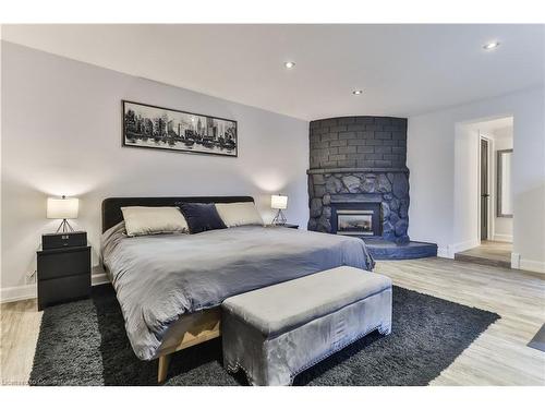 55 Deschene Avenue, Hamilton, ON - Indoor Photo Showing Bedroom With Fireplace