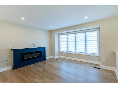 A-16 Jay Street, Hamilton, ON - Indoor Photo Showing Living Room With Fireplace