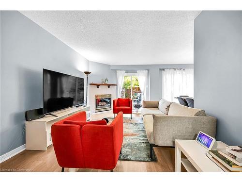 136 Essling Avenue, Hamilton, ON - Indoor Photo Showing Living Room With Fireplace