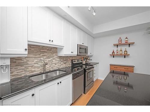 711-90 Charlton Avenue W, Hamilton, ON - Indoor Photo Showing Kitchen With Double Sink