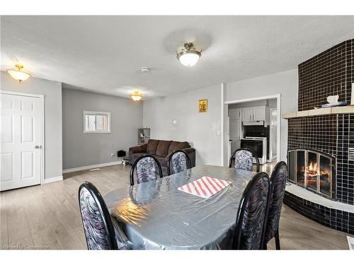 Main-81 East 23Rd Street, Hamilton, ON - Indoor Photo Showing Dining Room With Fireplace