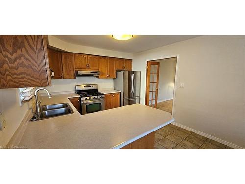 61 East 26Th Street, Hamilton, ON - Indoor Photo Showing Kitchen With Double Sink