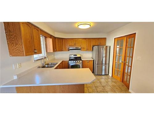 61 East 26Th Street, Hamilton, ON - Indoor Photo Showing Kitchen With Double Sink