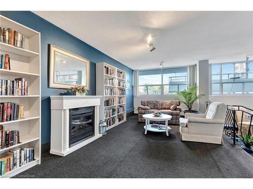 1505-2263 Marine Drive, Oakville, ON - Indoor Photo Showing Living Room With Fireplace