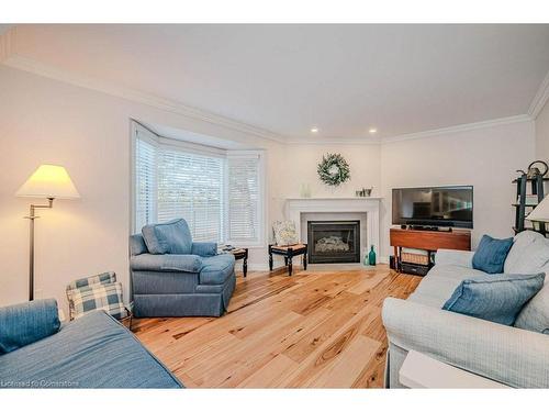 4-2145 Country Club Drive, Burlington, ON - Indoor Photo Showing Living Room With Fireplace