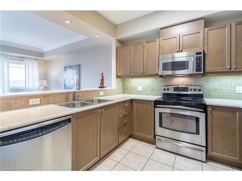 406-5340 Lakeshore Road, Burlington, ON - Indoor Photo Showing Kitchen With Double Sink