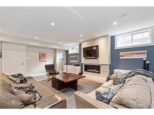 Lower-19 Redcliff Crt Court W, Hamilton, ON - Indoor Photo Showing Living Room With Fireplace