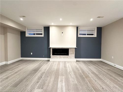 Lower-19 Redcliff Crt Court W, Hamilton, ON - Indoor Photo Showing Basement With Fireplace