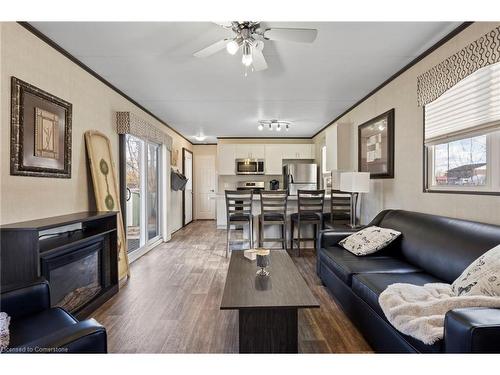 253-8845 Lundys Lane, Niagara Falls, ON - Indoor Photo Showing Living Room With Fireplace