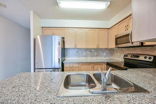 601-4850 Glen Erin Drive, Mississauga, ON - Indoor Photo Showing Kitchen With Double Sink