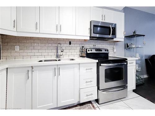 313 Fennell Avenue E, Hamilton, ON - Indoor Photo Showing Kitchen With Double Sink