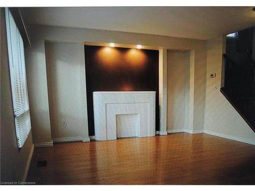 79 Broughton Avenue, Hamilton, ON - Indoor Photo Showing Other Room With Fireplace