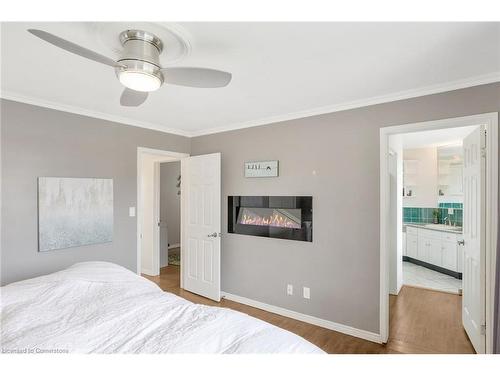 61 Blossom Avenue, Brantford, ON - Indoor Photo Showing Bedroom With Fireplace